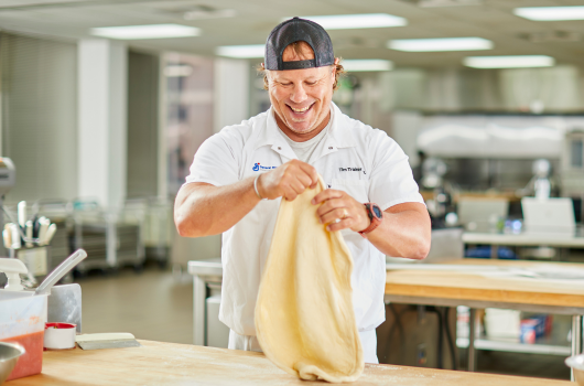 Chef making pizza dough.