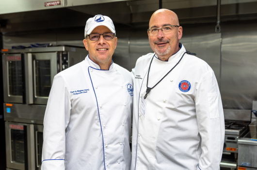 Two Chefs in White Coat.