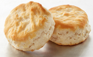 Two baked biscuits on a clear background